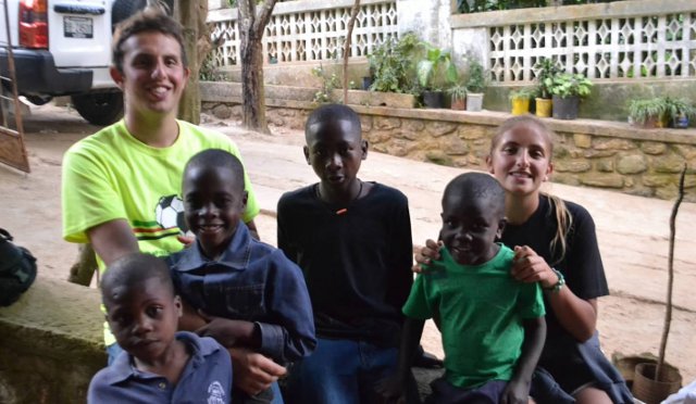 Kyle Weiss with children in Haiti