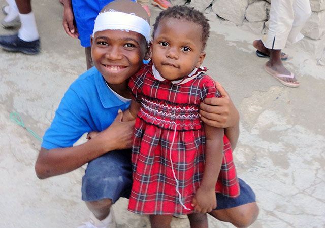 Brother & sister after the earthquake in Haiti