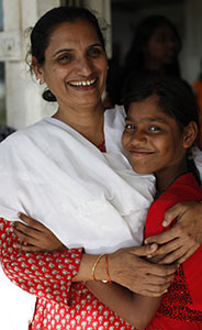 Triveni Acharya hugs one of the children in her program, Rescue Foundation