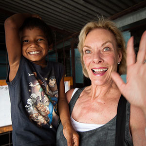 Co-Founder Kay Isaacason-Leibowitz with a child in Nepal