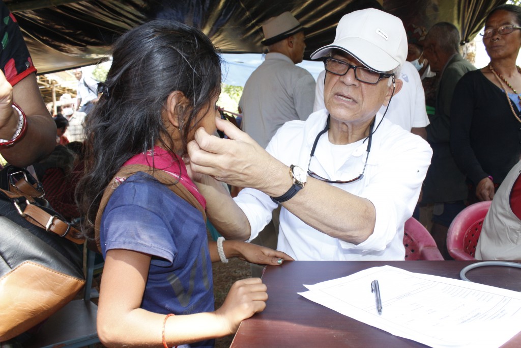 Dr. Banskota examining a patient at an earthquake relief clinic (4)