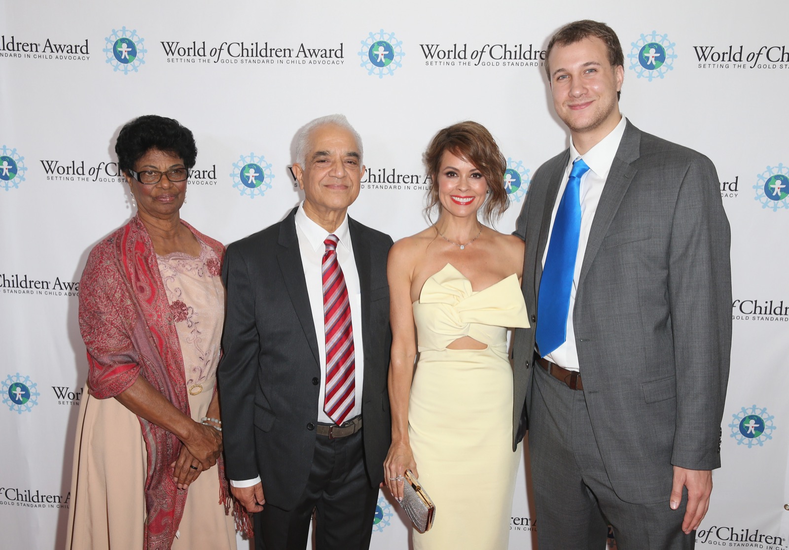 BEVERLY HILLS, CALIFORNIA - APRIL 12: (L-R) 2016 Alumni Honoree, Director of Caminante Proyecto Educativo Denisse Pichardo, 2016 Alumni Honoree and Founding Chairman of the Hospital and Rehabilitation Center for Disabled Children Dr. Ashok Banskota, Emcee and CEO of ModernMom Brooke Burke-Charvet and 2016 Alumni Honoree Ryan Hreljac attend World Of Children Award 2016 Alumni Honors at Montage Beverly Hills on April 12, 2016 in Beverly Hills, California. (Photo by Joe Scarnici/Getty Images for World of Children)
